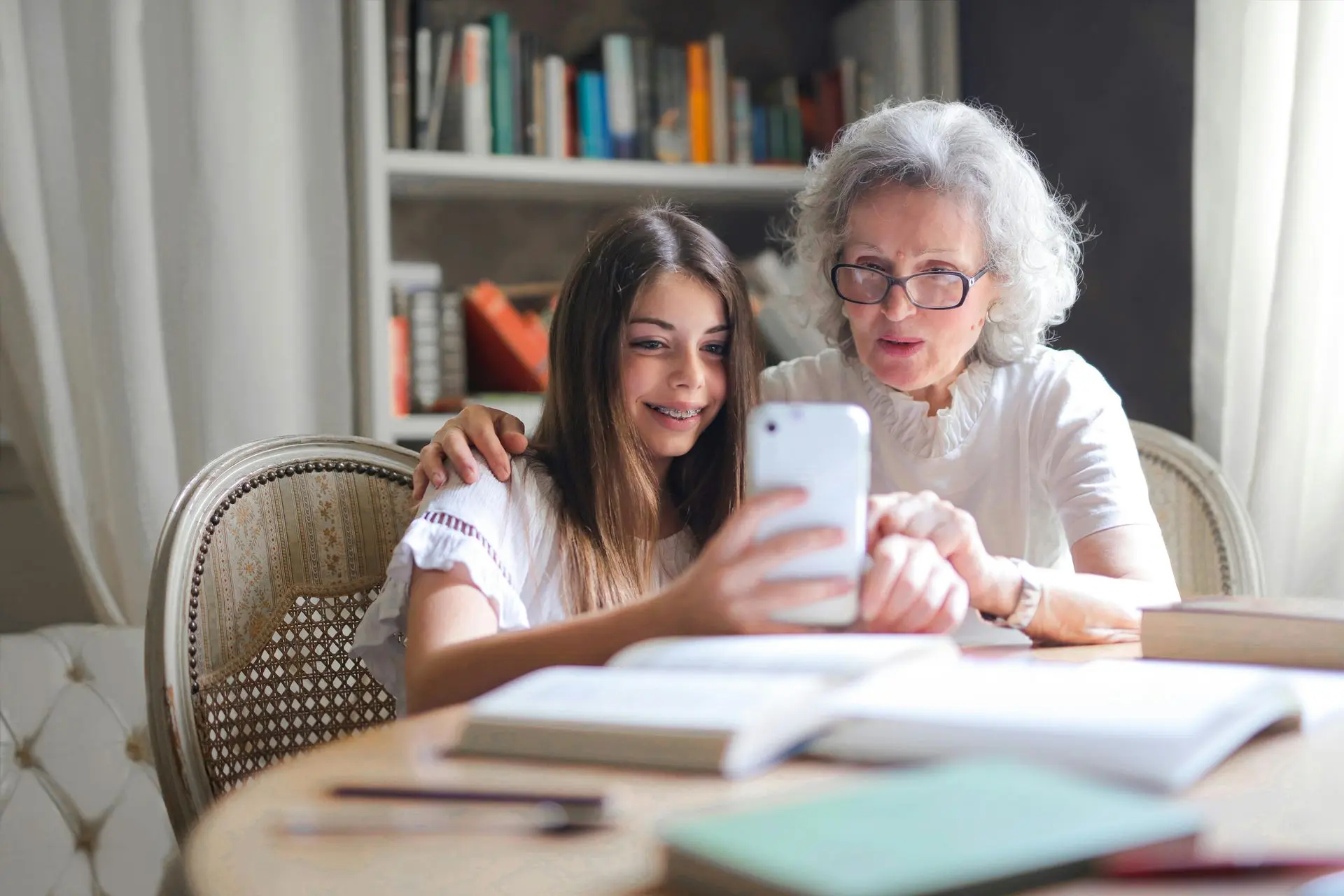 grandma and granddaughter on phone